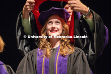 Rachel Higgins receives her hood at the 2025 College of Law commencement in the Lied Center. May 3, 