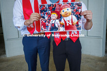 (Left) Brady Moylan and Ben Hastreiter hold a photo of Herbie and ‘Lil Red in preparation to revea