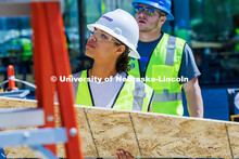 Senior, Jaeda Jeffries, holds a plank of wood as she works on her group’s shed for her Vertical Co