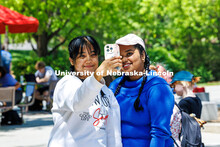 Graduate students (left) Anisha Khandokar and Bhavana Sreekumar take a selfie after getting their ha