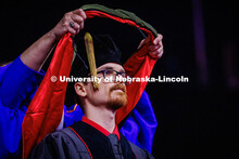 Austin Spoor receives his Doctor of Audiology and Hearing Science hood. 2025 Spring Graduate Commenc