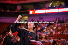 Accountancy graduate student, Connor Morrissey, fist pumps the air on his way out of the Graduate Co