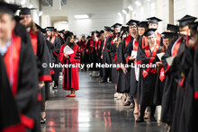 Dr. Anwesha De glances at students as they line up in the hall of Pinnacle Bank Arena before the Uni