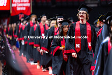 Luke Stursma looks into the audience as he walks to his seat in Pinnacle Bank Arena during the proce