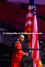 Chancellor Rodney D. Bennett pauses while speaking at the podium to graduating students, their famil
