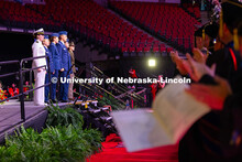 Students and faculty clap for ROTC students who gave their Oath of Office during the morning commenc