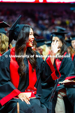Amy Le waves to her family in the seats near her at Pinnacle Bank Arena. Le is a graduate of the Col