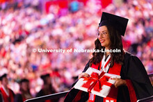 Chancellor's Scholar and political science major Audrey Ellis walks down the ramp after receiving he