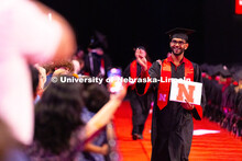 Gowrav Ghatameneni waves toward his family after receiving his diploma. Ghatameneni majored in compu