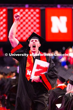 Ian Kruse pumps his fist in the air after receiving his diploma. Kruse majored in Hospitality, Resta