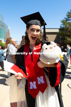 Faith Polivanov poses with a graduation plushie outside of Pinnacle Bank Arena. Polivanov received h