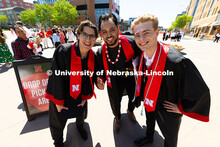 Zach Irene, Diego Escobar and Frank Meisinger (l-r) pose together outside of the Pinnacle Bank Arena
