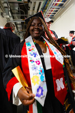 Aya Boko shows off the stole signed by her students. Boko received her Bachelor of Science in Elemen