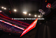 A pair of flower bouquets wait in cupholders in Pinnacle Bank Arena to be given to graduates after t