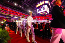 Members of the University of Nebraska–Lincoln's ROTC program march from their seats to the stage a