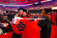 Dr. Kim Hansen hugs Alyssa Vetere, who served as a teaching assistant in Hansen's human physiology c