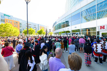 Family and friends watch for their graduates as they exit Pinnacle Bank Arena following the afternoo