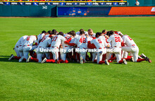 The Husker baseball team huddles prior to their game against Minnesota. Nebraska vs Minnesota baseba