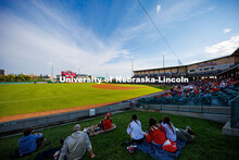 Fans sit on the berm to watch the Nebraska baseball team play Minnesota. Nebraska vs Minnesota baseb