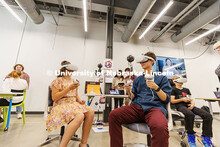Ian Tuck (right), a sophomore Emerging Arts major, tests out a VR project during Open Studios Night 