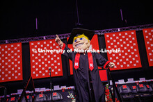 Herbie points into the air to celebrate the May 2025 Commencement Undergraduate Commencement in Pinn