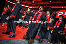 Senior Marketing major, Ben Hastreiter, wears Herbie feet for commencement as he was a mascot for th