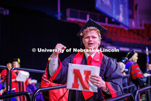 Senior Marketing major, Ben Hastreiter, fists-pumps the air after receiving his diploma. May 2025 Co
