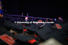 In a sea of mortarboards one decorated grad cap reads “The Rest is Still Unwritten”. May 2025 Co