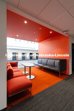 Couches line an alcove overlooking the central lobby of the new Hixson-Lied College of Fine and Perf