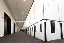 Plate glass walls on the third floor allows plenty of natural light to reach faculty and staff offic