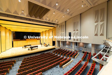 Glenn Korff School of Music students and staff move a harpsichord onto the stage of the newly renova