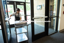 Marilou Wyatt, East Campus Dining Services production manager, takes a cart loaded with smoked chick