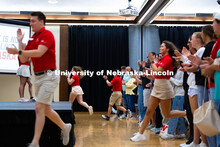 New Student Enrollment leaders run through the crowd of new students and their parents and guardians