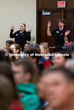 Makayla Larntz and Jameson Margetts, both support specialists for New Student Enrollment, provide di