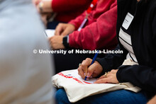 A parent starts writing to their student during the welcoming session of New Student Enrollment. Pos