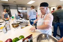 Elaine Rouse, kitchen manager for St. Margaret Mary School in Omaha, dices an onion that will be use