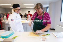 Brenda Windmuller stops to chat with Renee Cornett, food and nutrition services operations manager f