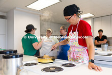 Lynsey Graham, director of nutrition services for Johnson County Central Public Schools, stirs a ste
