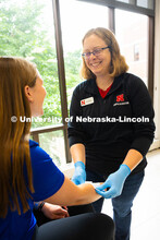 Jen Krueger, Senior Coordinator for Injury Prevention and Care, smiles at Kelci Davis, one of her st