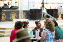Jeanne Baer (second from left) sits with friends and several of her former students from Lincoln Lit