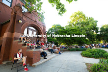 Jazz in June fans gather on the shaded steps of Architecture Hall on Tuesday, June 10. 