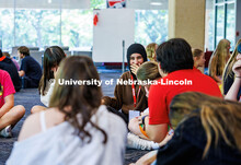 An incoming Husker laughs amongst her group during New Student Enrollment Life of a Husker presentat