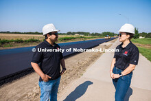 Nitish Bastola and Taisa Medina, PhD Civil Engineering students at UNL, beside Foundry Road in South