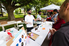 Abdul Hamid, a nutrition science doctoral student, speaks with Discovery Days visitors Igra Igbal an