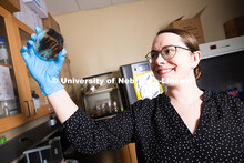 Erin Carr, a postdoctoral research associate in chemical and biomolecular engineering, holds up a pe