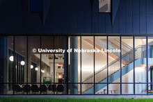 Chairs wrapped in plastic to protect against dust are pushed against the south windows of the new Fi