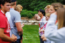 An incoming Husker smiles at his group partner as they play an ice breaker game in between sessions.