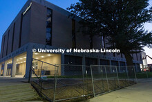 Fencing goes up around Westbrook Music Building prior to its demolition in the summer 2025. June 18,