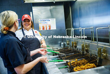 Victoria Dodd (left), the Assistant Food Service Manager, speaks with Paige Knebel, the Chef de Cuis