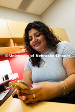 Academic navigators, like Josselyn Vazquez-Catalan, can communicate with students through text messa